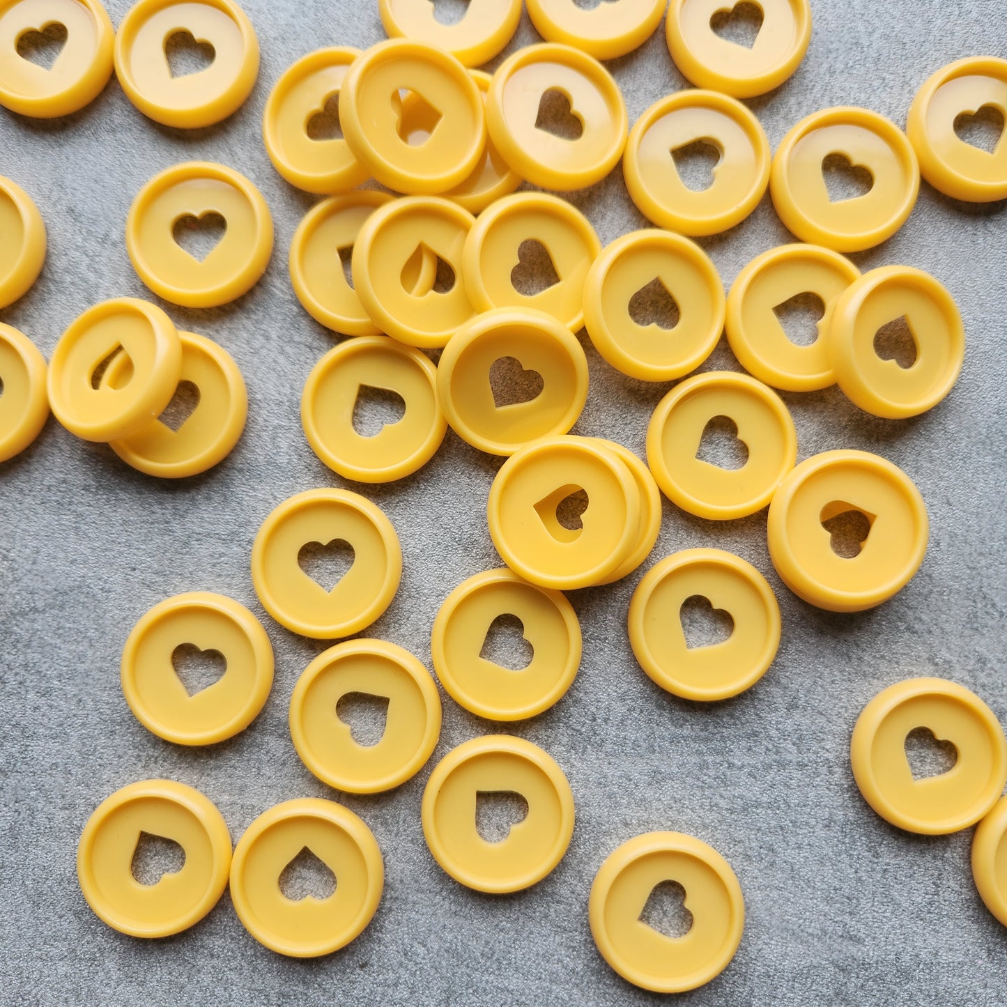 24mm plastic disc, orange with heart