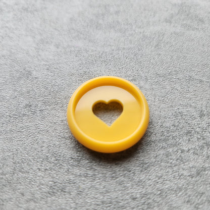 24mm plastic disc, orange with heart